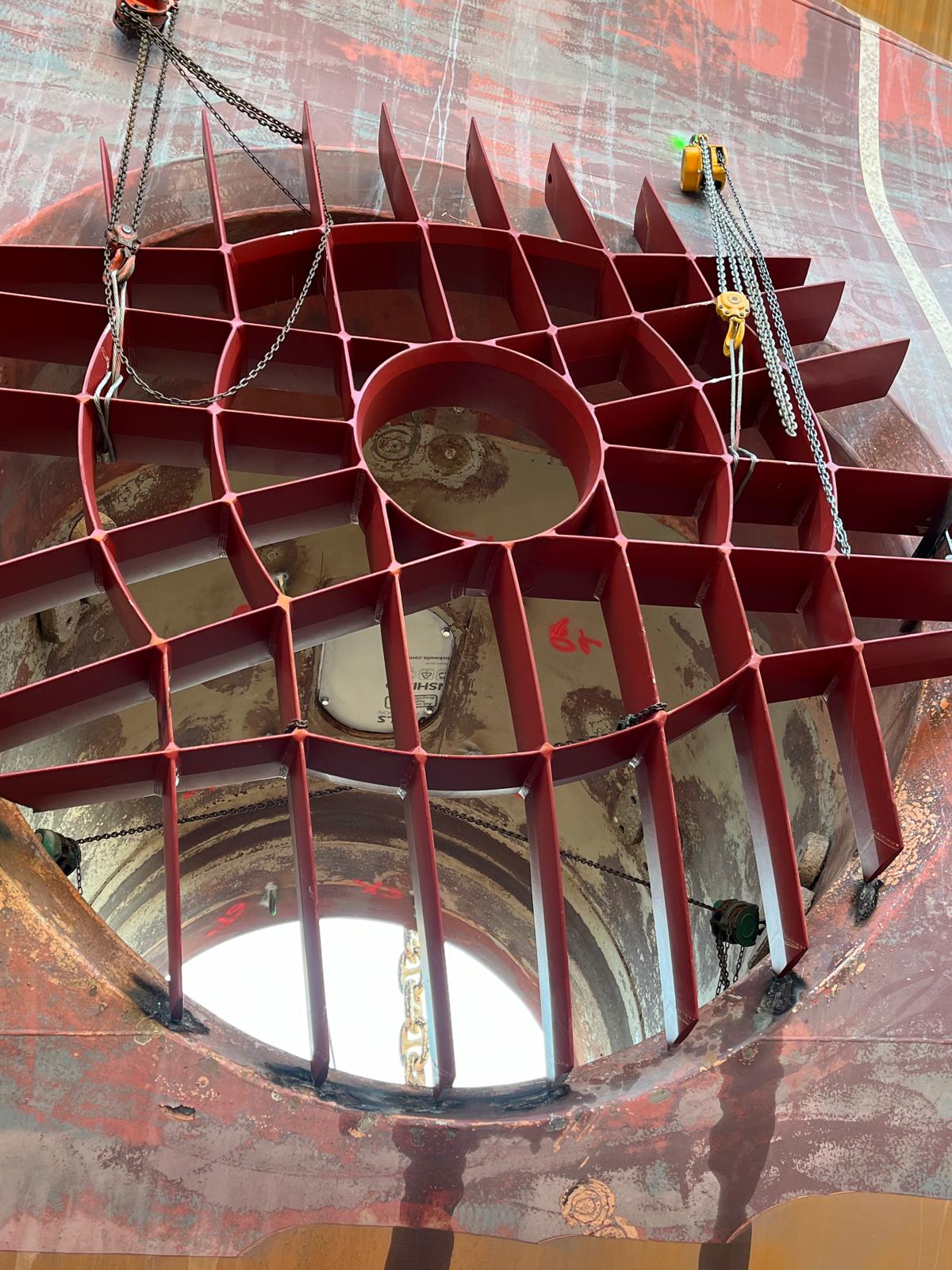 Thruster grid positioning with hoists